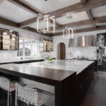 A large kitchen with lots of counter space and lights.