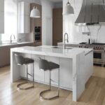 A kitchen with white cabinets and wooden floors